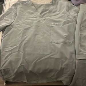 Sliver scrubs with neon detail .